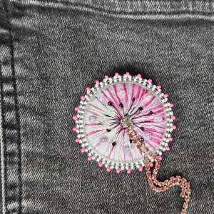 Dmuchawiec róż broszka