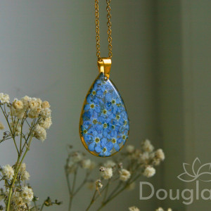 Łezka z żywicy z niezapominajkami, ramka stal chirurgiczna