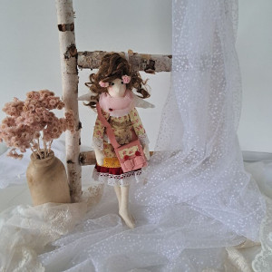 anioł stróz z torebeczką koniec roku szkolnego