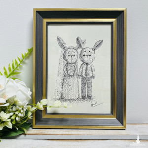 Młoda para króliczki w ramce rysowane piórkiem prezent ślubny obraz