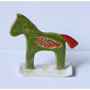 Zielony konik nakrapiany na biegunach