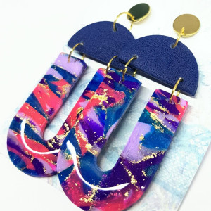 Boskie kolczyki z kolekcji Kosmos litera U