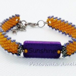 pozytywnie drewno ze szkłem curry&fiolet  beading